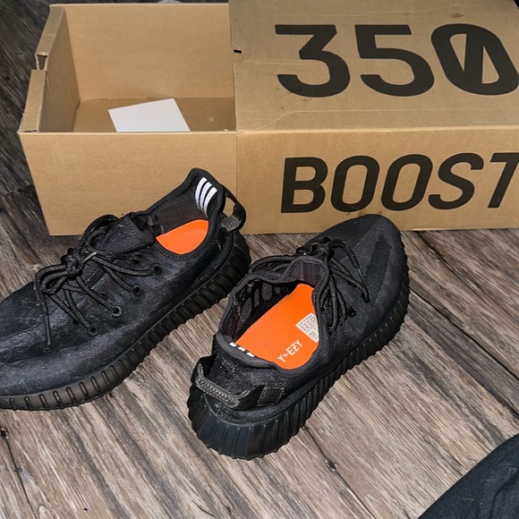 black yeezys in box